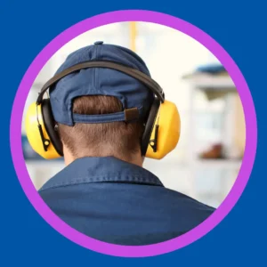 A man wears hearing protection. 