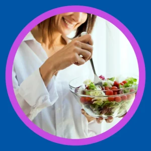 A woman eats a salad. 