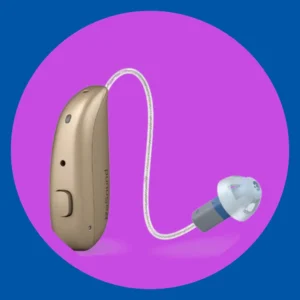 A gold Resound Nexia hearing aid stands on  purple background. 