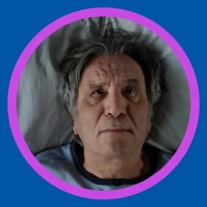 A man stares at the ceiling while trying to sleep. 