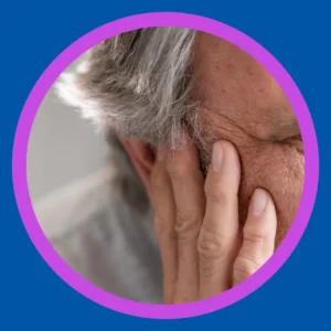 A man holds his ear. 