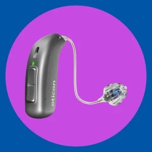 A silver Oticon Real hearing aid sits on a purple background.