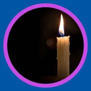 A lit candle stands against a black background.