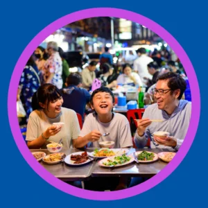 A family eats together in a food hall.