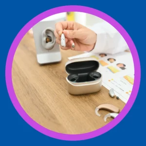 An audiologist demonstrates how hearing aids work. 