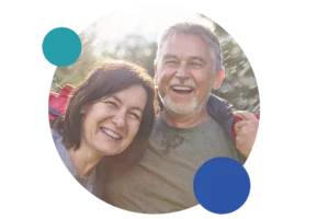 A smiling couple enjoys the outdoors.