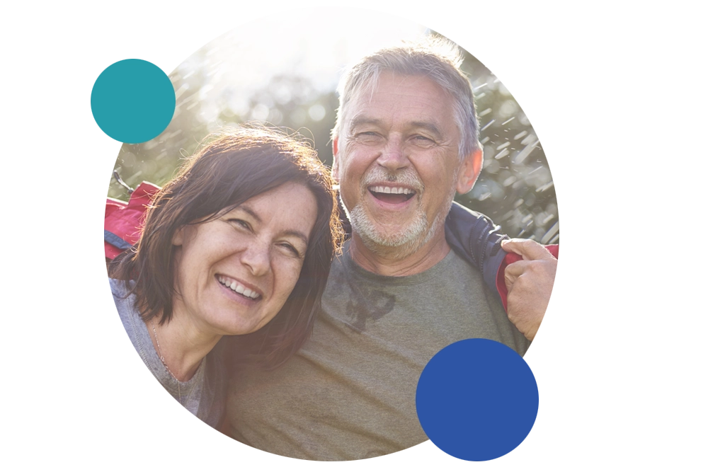 A smiling couple enjoys the outdoors.